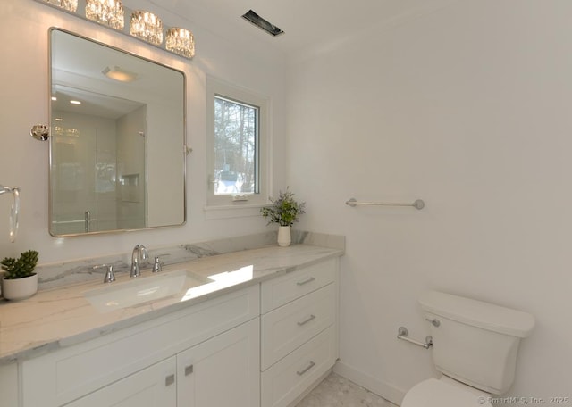 full bathroom with toilet, a shower with shower door, baseboards, and vanity