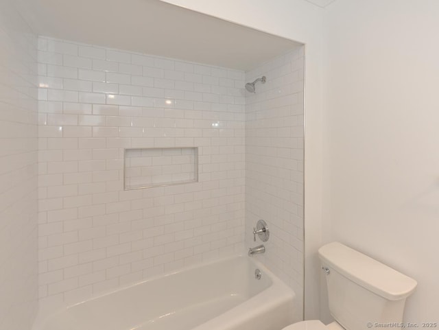 bathroom featuring shower / bath combination and toilet