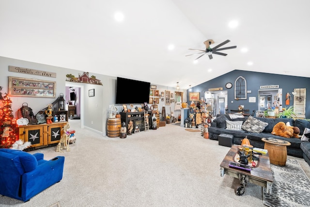 carpeted living area with lofted ceiling and ceiling fan