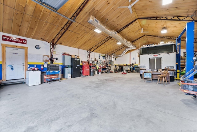 garage featuring a workshop area and wood ceiling