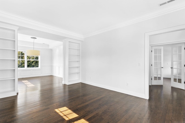 unfurnished living room featuring crown molding, french doors, built in features, dark wood-type flooring, and baseboards