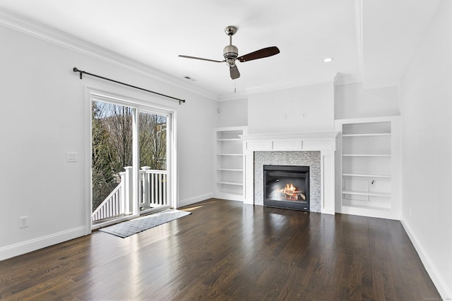 unfurnished living room with ceiling fan, ornamental molding, baseboards, wood finished floors, and recessed lighting