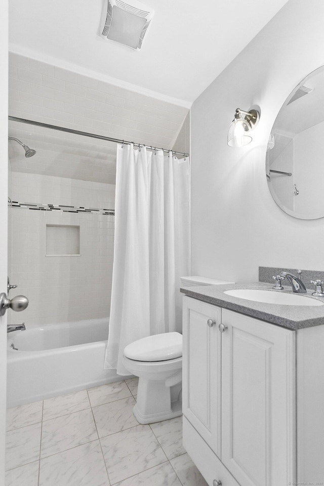 bathroom with marble finish floors, toilet, shower / bath combo, and vanity