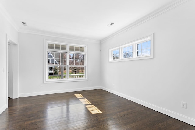 unfurnished room featuring ornamental molding, baseboards, and dark wood-type flooring