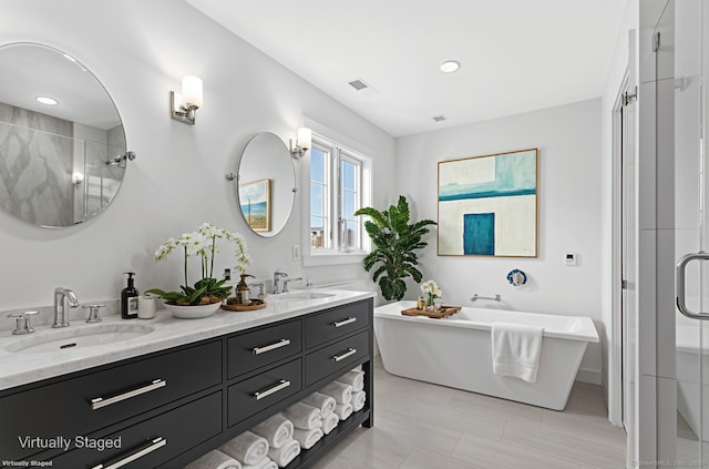 430 Edward St, Fairfield, CT 06824 - bathroom featuring a shower stall, double vanity, and a freestanding tub