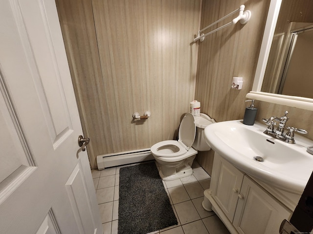 189 Kaynor Dr Apt C, Waterbury, CT 06708 - bathroom featuring a baseboard heating unit, tile patterned flooring, vanity, and toilet