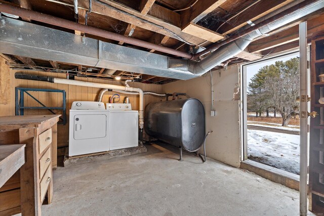 basement with washer and dryer and heating fuel