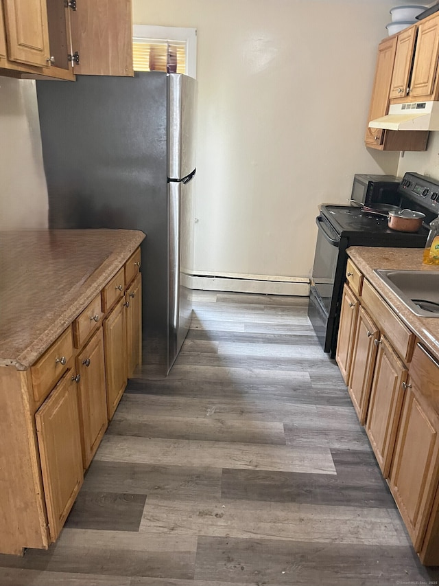 kitchen with black range with electric cooktop, baseboard heating, dark wood finished floors, and under cabinet range hood