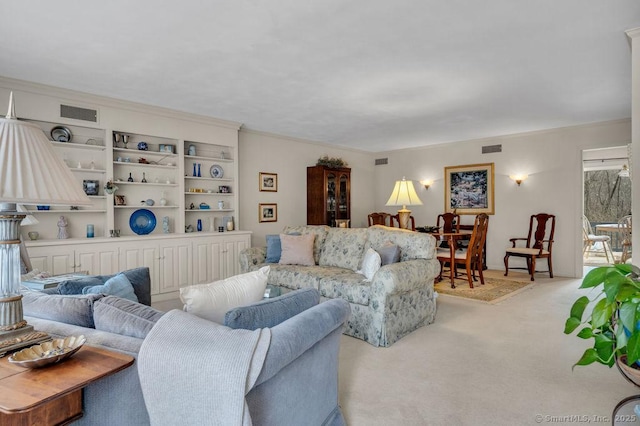 living area with light carpet and visible vents