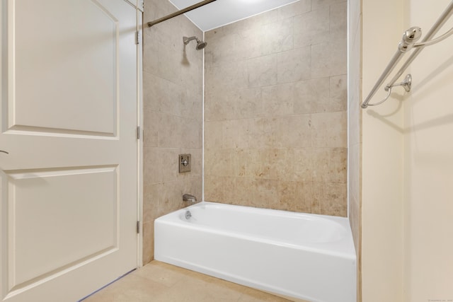 full bath with washtub / shower combination and tile patterned floors