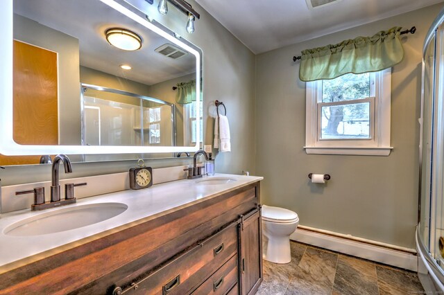 full bath with baseboard heating, a sink, visible vents, and a shower stall