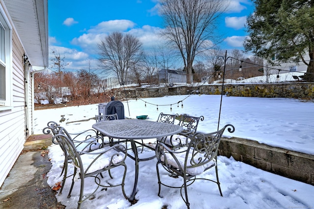 view of snow covered patio