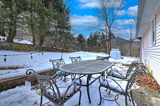 view of snow covered patio