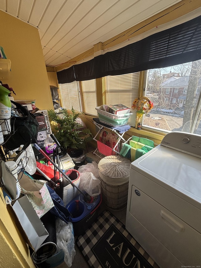 interior space featuring a sunroom, wood ceiling, and washer / clothes dryer