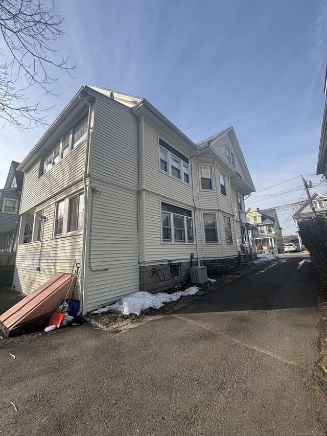 view of property exterior featuring central AC