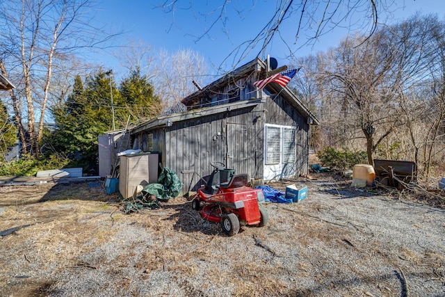 view of side of home with an outbuilding