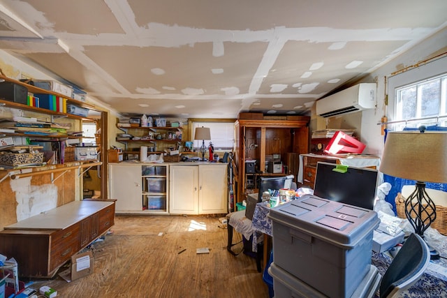 interior space featuring an AC wall unit and light wood-style flooring