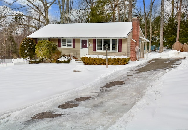 view of front of home with a chimney