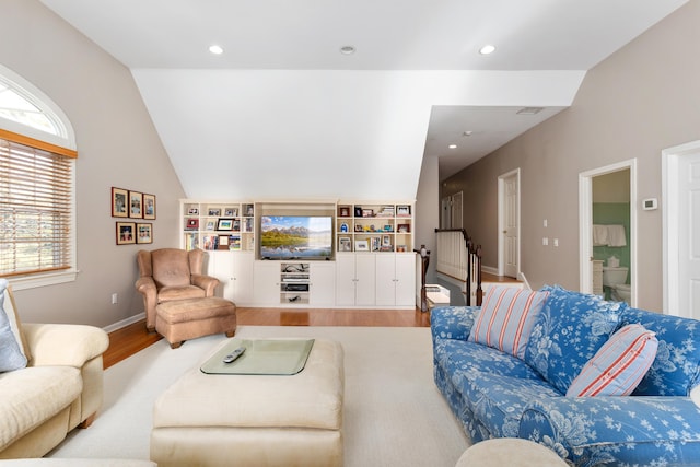 living area with lofted ceiling, baseboards, recessed lighting, and wood finished floors