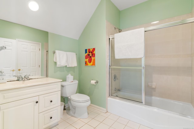 bathroom featuring lofted ceiling, toilet, combined bath / shower with glass door, vanity, and tile patterned floors