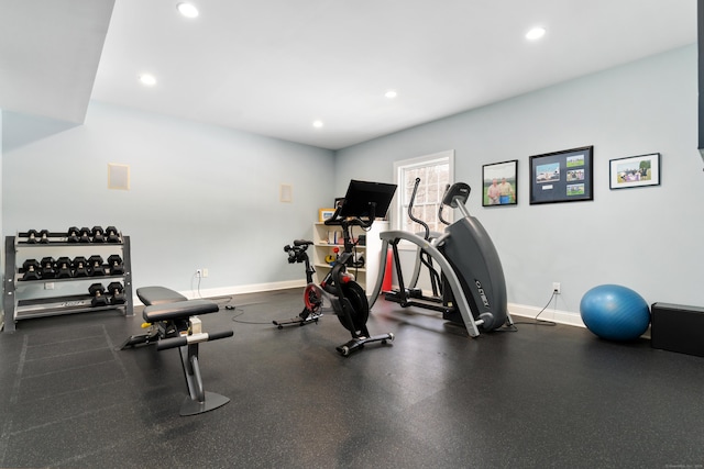 exercise room featuring recessed lighting and baseboards