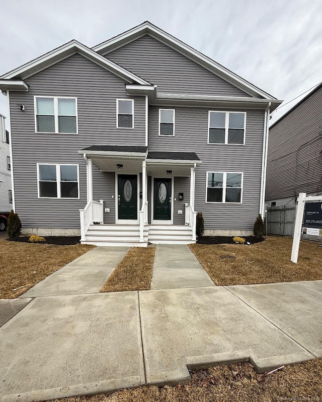 view of front of house with fence