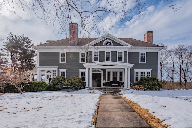 view of front of property with a chimney and a pergola