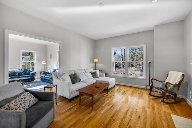 living room featuring baseboards and light wood-style floors