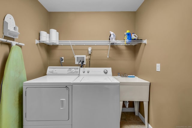 laundry area featuring laundry area, tile patterned floors, and washer and dryer