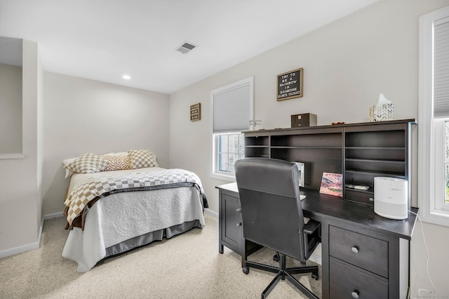 bedroom with visible vents and baseboards