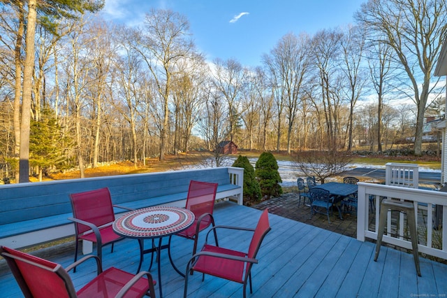 wooden terrace featuring outdoor dining space