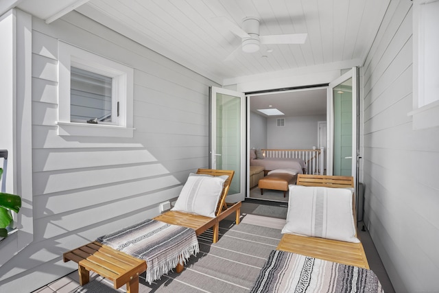 balcony featuring visible vents and a ceiling fan