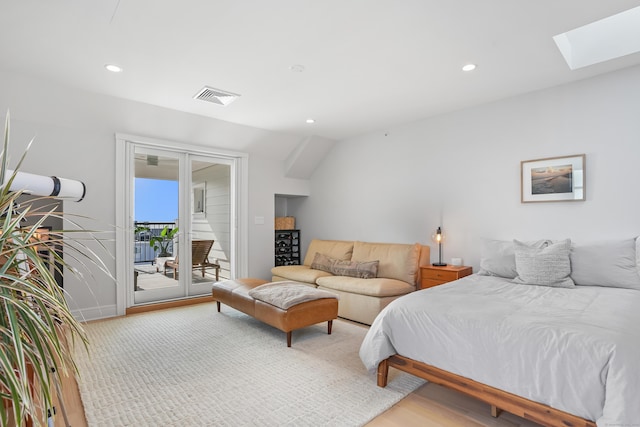 bedroom featuring access to exterior, a skylight, visible vents, and recessed lighting