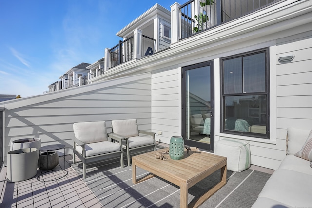 wooden terrace with outdoor lounge area