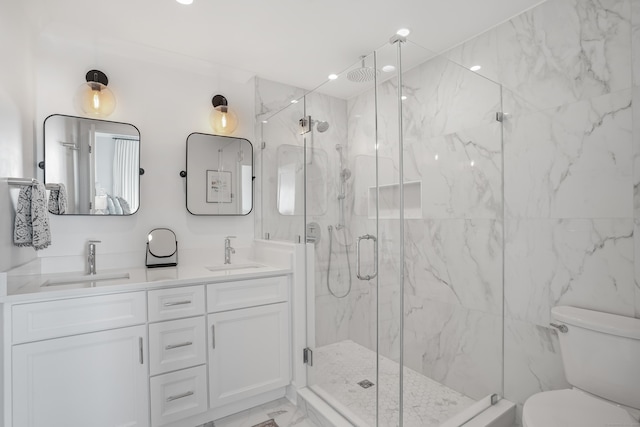 bathroom with toilet, marble finish floor, a sink, and a marble finish shower