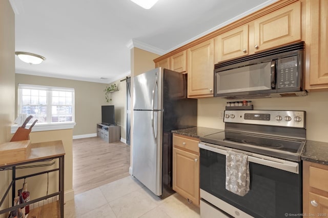 kitchen with light tile patterned floors, ornamental molding, dark stone countertops, stainless steel appliances, and light brown cabinets