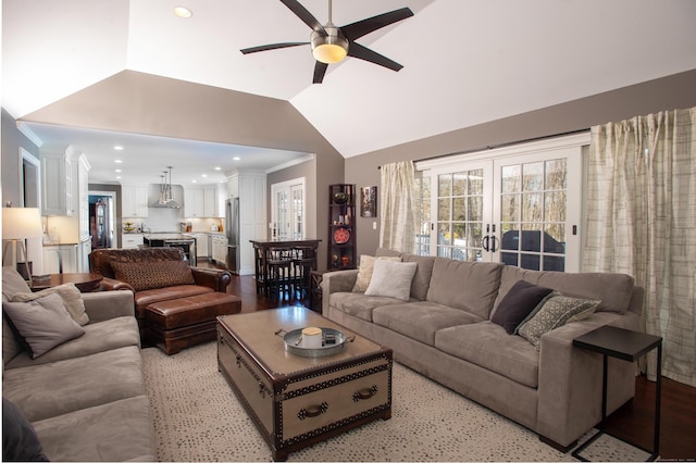 living room with a ceiling fan, recessed lighting, french doors, crown molding, and vaulted ceiling