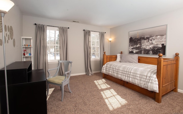 bedroom with visible vents, baseboards, and carpet flooring