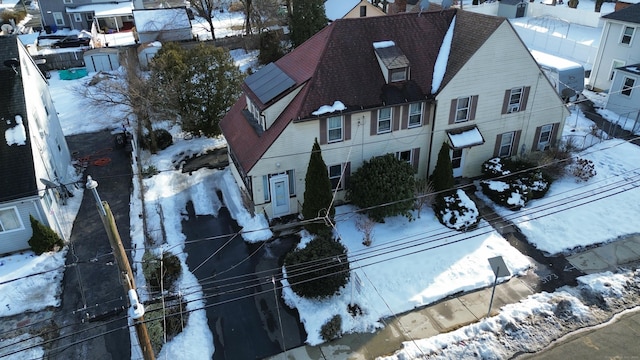 snowy aerial view with a residential view