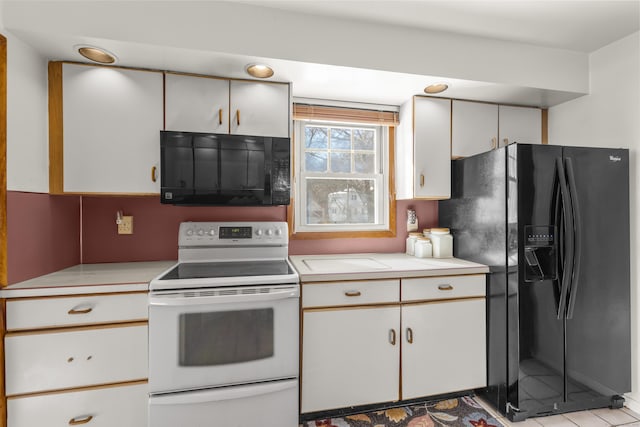 kitchen with black appliances and light countertops