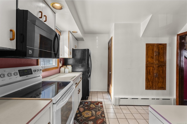 kitchen featuring black microwave, range with electric cooktop, white cabinets, and a baseboard heating unit