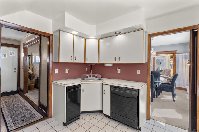 kitchen featuring light countertops, dishwasher, and white cabinetry