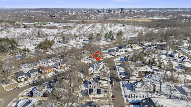 snowy aerial view featuring a residential view