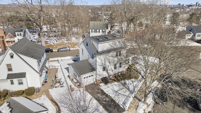 snowy aerial view featuring a residential view