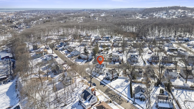 snowy aerial view with a residential view