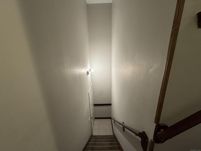 stairway featuring tile patterned floors