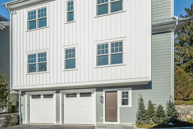 25 Henry St Unit B, Greenwich, CT 06830 - view of front of home with aphalt driveway and an attached garage