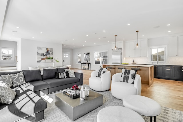 living room featuring recessed lighting and light wood-style flooring