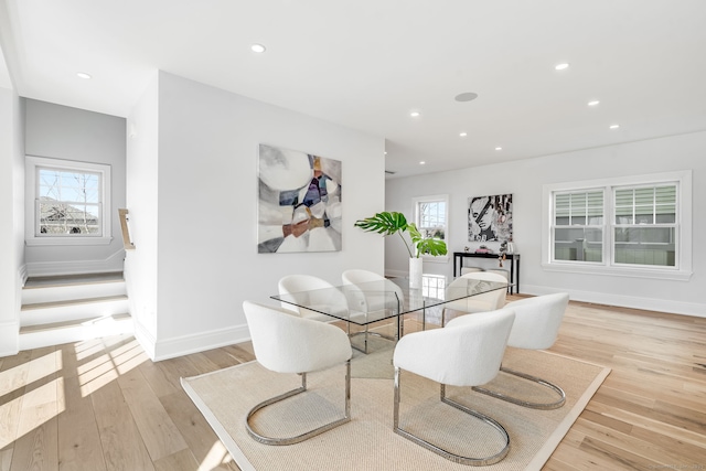 dining room featuring a healthy amount of sunlight, light wood-style floors, and recessed lighting