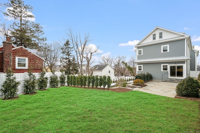 view of yard featuring entry steps and a patio